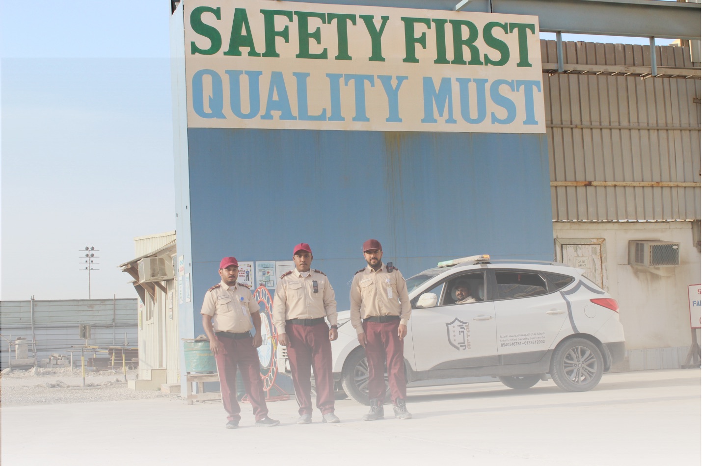 Professional security team with company vehicle