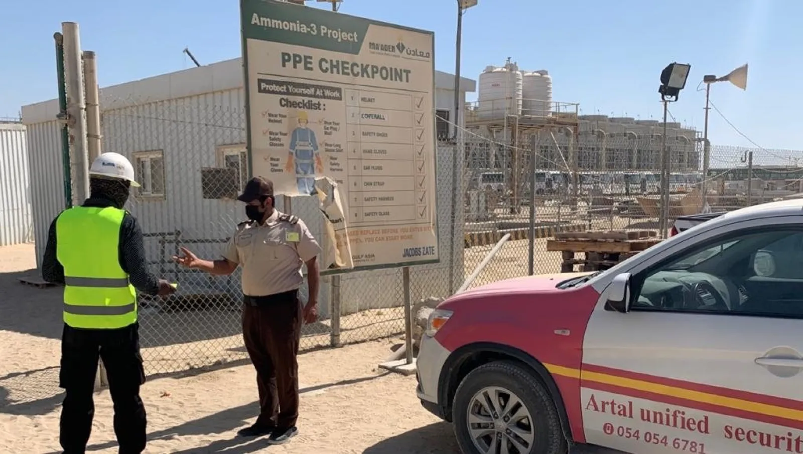 Security guard monitoring a construction site perimeter
